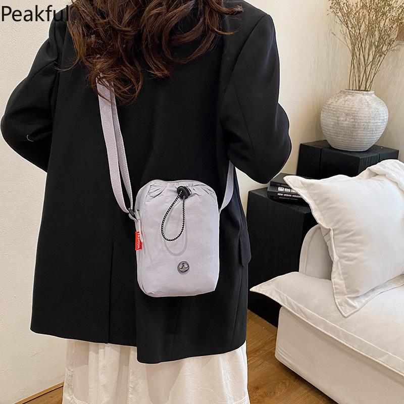Viral Mini Drawstring Nylon Sling Bag, Fashion Casual Cinch Crossbody Purse, Lightweight Adjustable Strap Shoulder Bag, water-resistant fabric & multi-color options, ideal for travel, gym sessions and everyday hands-free use