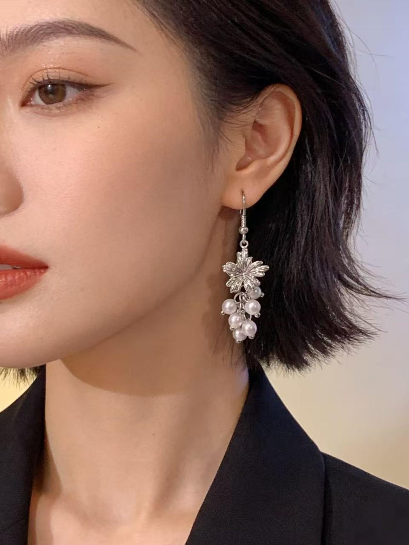 Exquisite metallic maple leaf shape with layered pearl tassels, creating a gentle and romantic vibe. The dangle design sways elegantly, adding a touch of sophistication to your daily look.