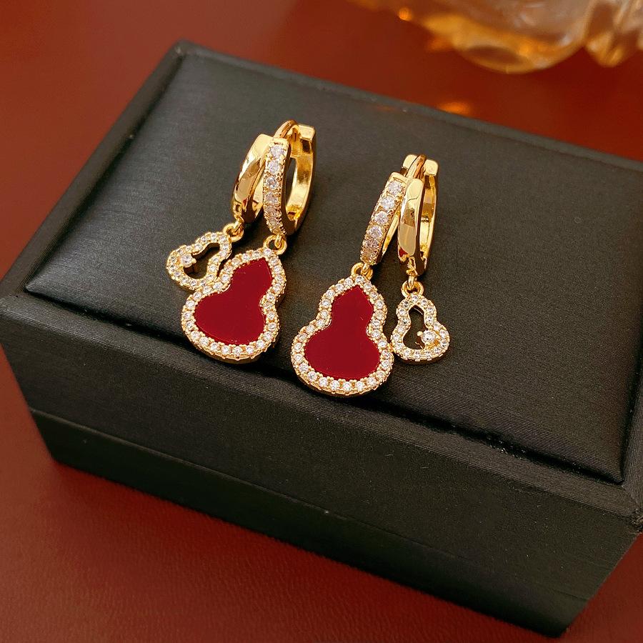 A pair of zirconia drop earrings featuring openwork ear hooks with real gold plating in an elegant, light-luxury Oriental style exquisite, versatile New Chinese-style earrings