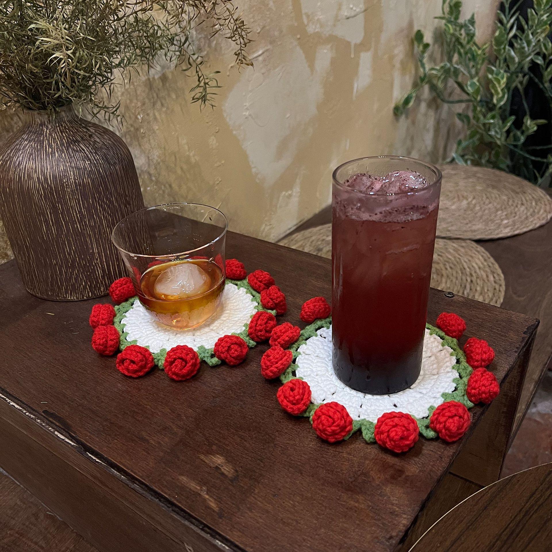 Handmade rose bouquet coasters, yarn crocheted cup holders transformed into handheld bouquets