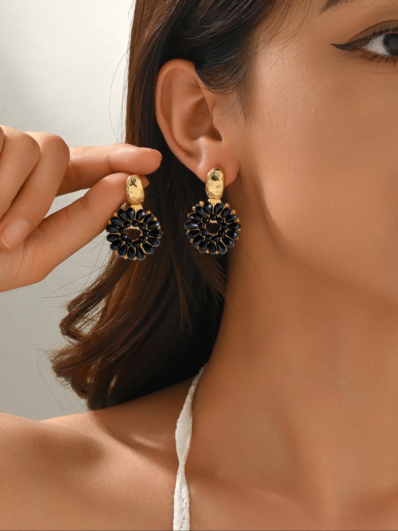 A pair of handcrafted, beaded dangle earrings featuring a chic Bohemian resort style. These round earrings exude an elegant, refined, and understated aesthetic with a premium feel, available in a variety of colors. for women to wear on any occasio