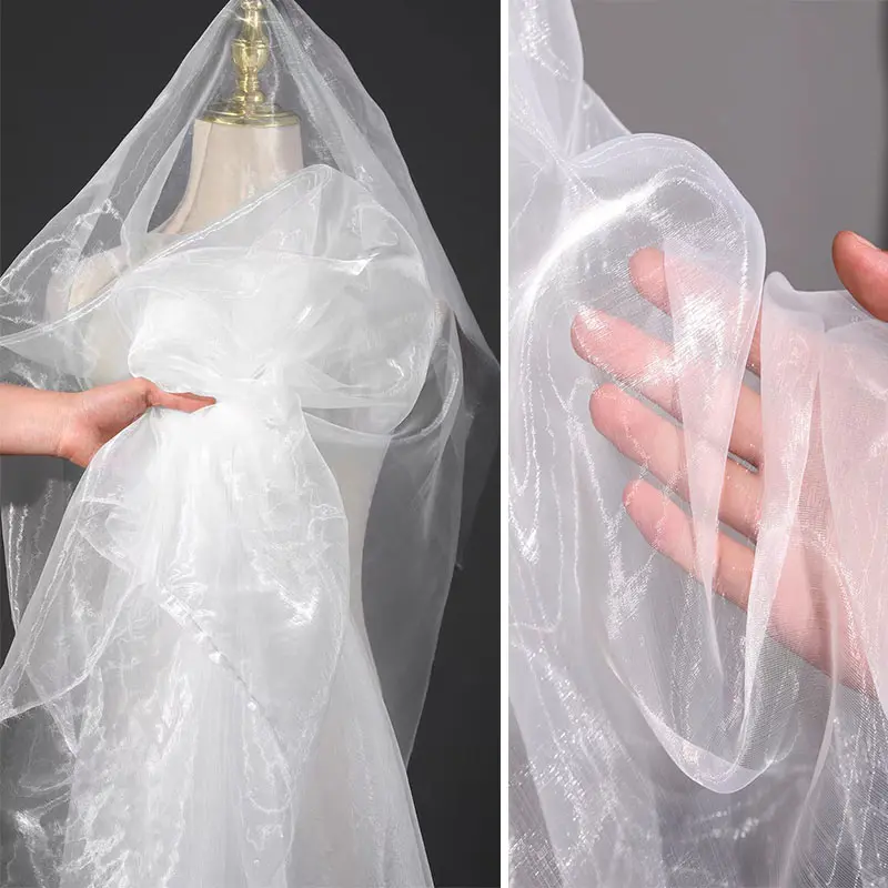 White shimmering sheer fabric, lightweight and breathable mesh material, suitable for DIY crafts, apparel, and wedding decorations