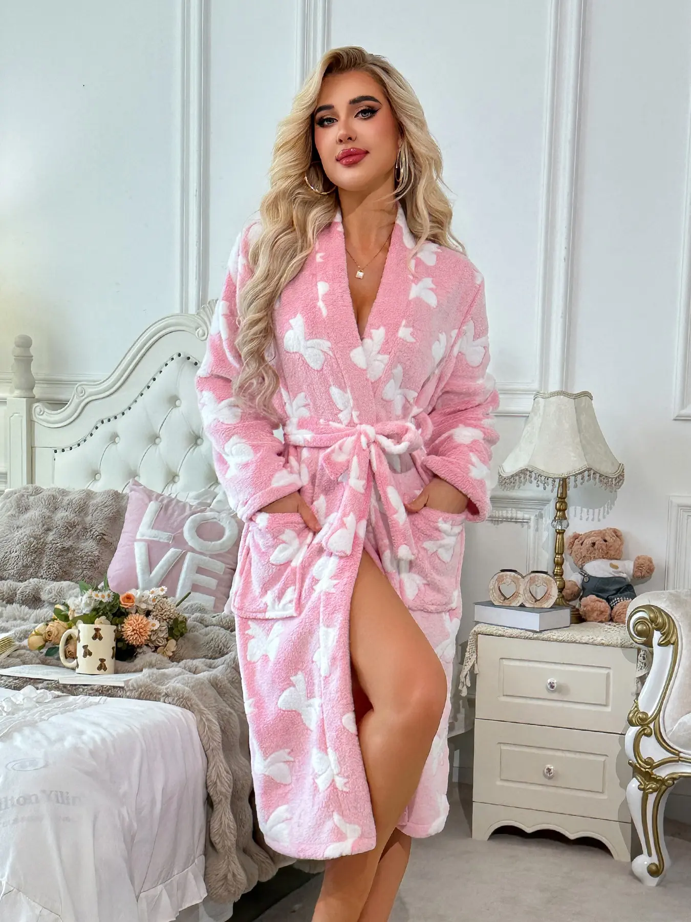 Women's Long Fleece Robe, Long sleeve, pink base with all-over white bow print, soft skin-friendly thick plush, matching waist belt and side pockets, warm autumn-winter loungewear, for home relaxation and casual vacation wear