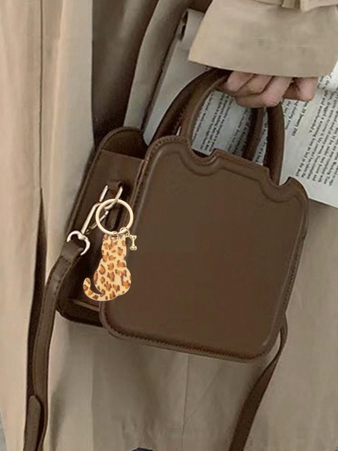 Double-sided acrylic leopard print cat and dog bone keychain, a fashionable, classic, and cool animal-themed bag accessory and DIY jewelry component. Can be attached to backpacks, handbags, car keys, house keys, and phone accessories. Versatile Attachment