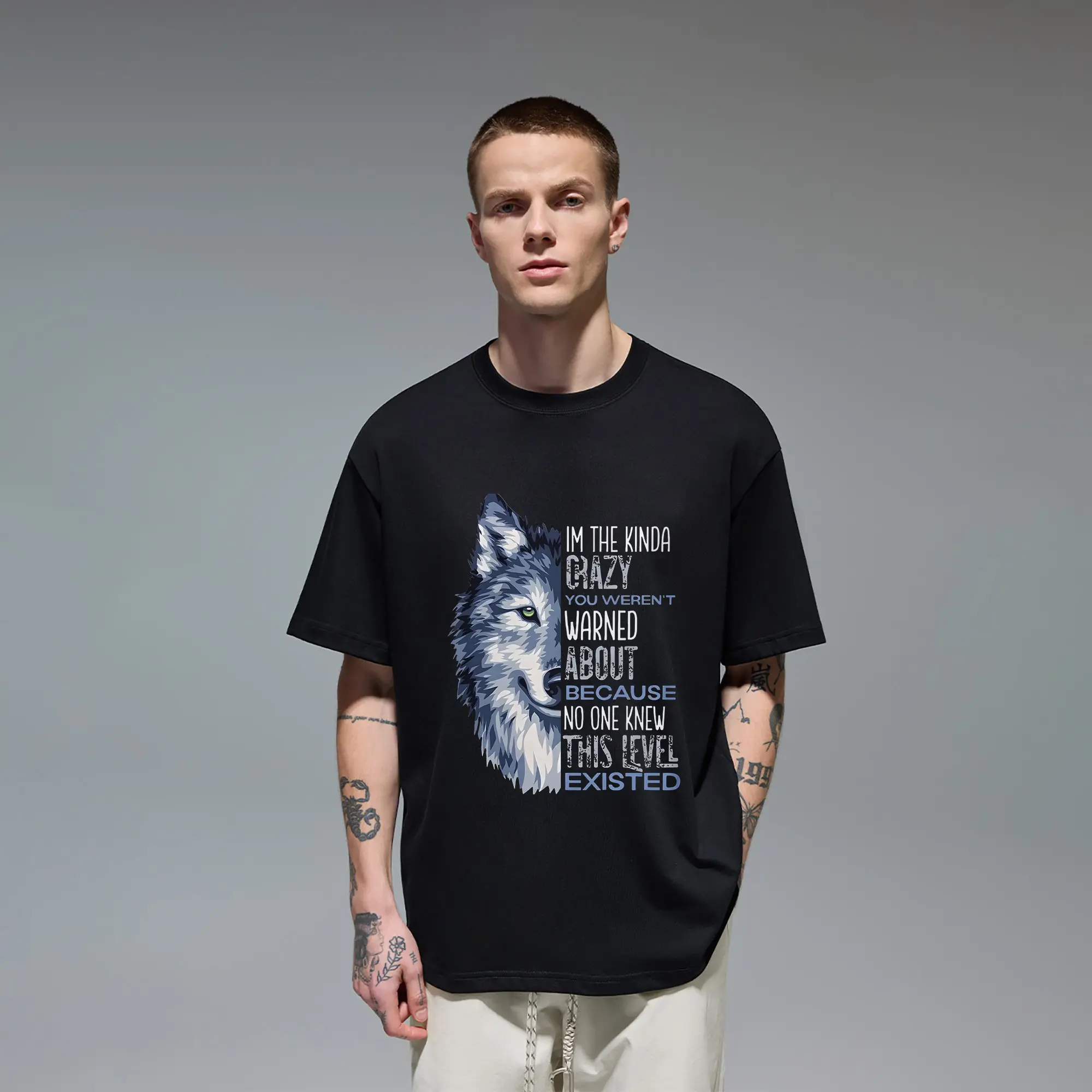 Edgy expressive Men's T‑Shirt constructed of Quality Cotton, adopting striking split layout combining detailed wolf artwork and powerful motivational text. Laid‑back relaxed fit for men preferring bold unique graphic pieces for daily wear, hangouts and ca