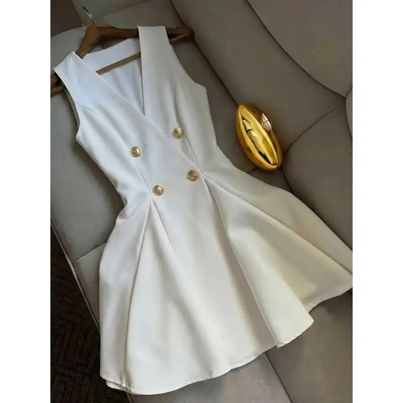 White sleeveless double-breasted blazer dress featuring an elegant and chic sophisticated V-neck, a waist-cinching fit, and a flared A-line skirt-suitable for the workplace and semi-formal occasions.Elegance