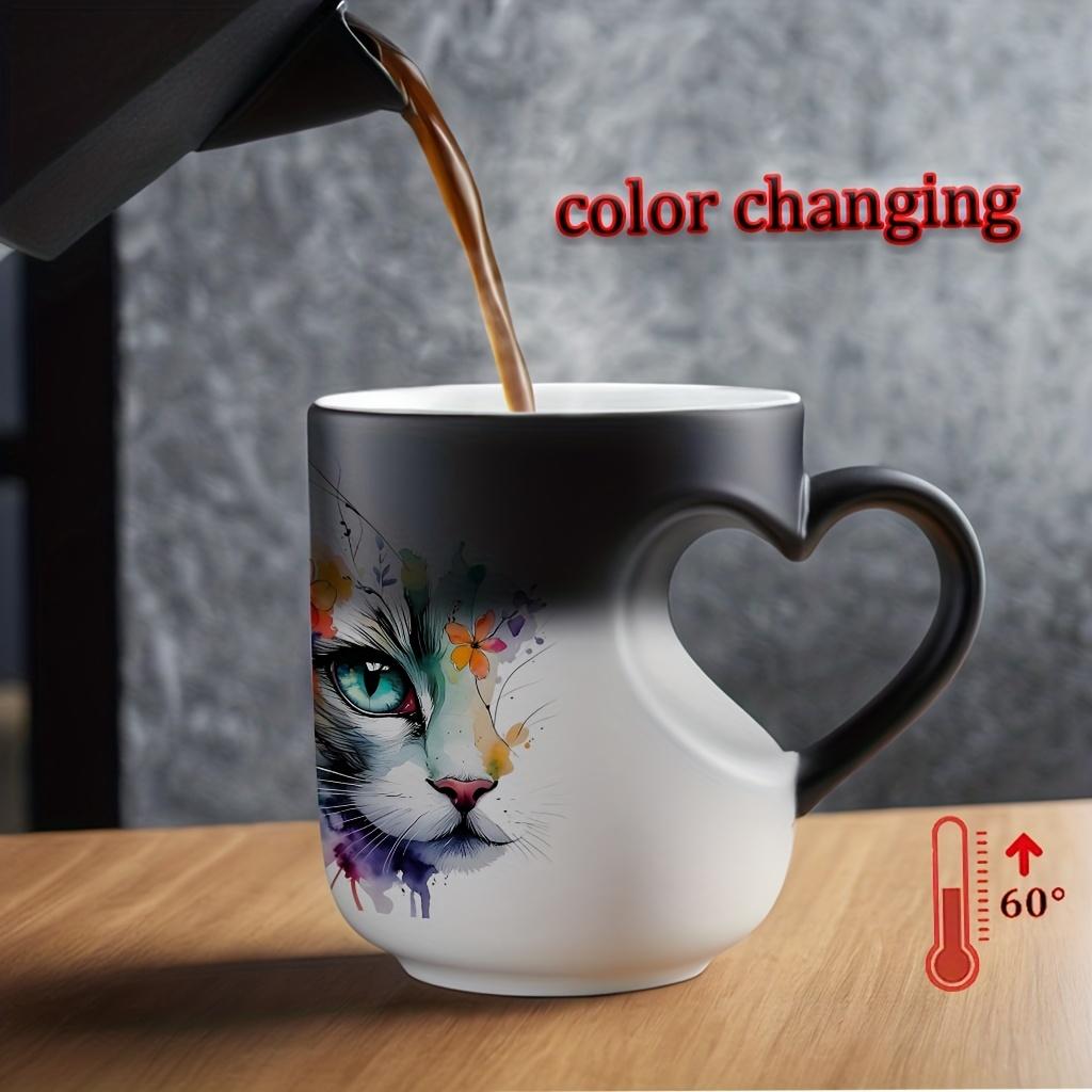 Playful Watercolor Cat Flower Decor: A vibrant artistic depiction set in a color-changing ceramic mug that changes color with temperature and features a heart-shaped handle. Perfect for coffee, this 11oz/330ml mug makes a wonderful Christmas gift