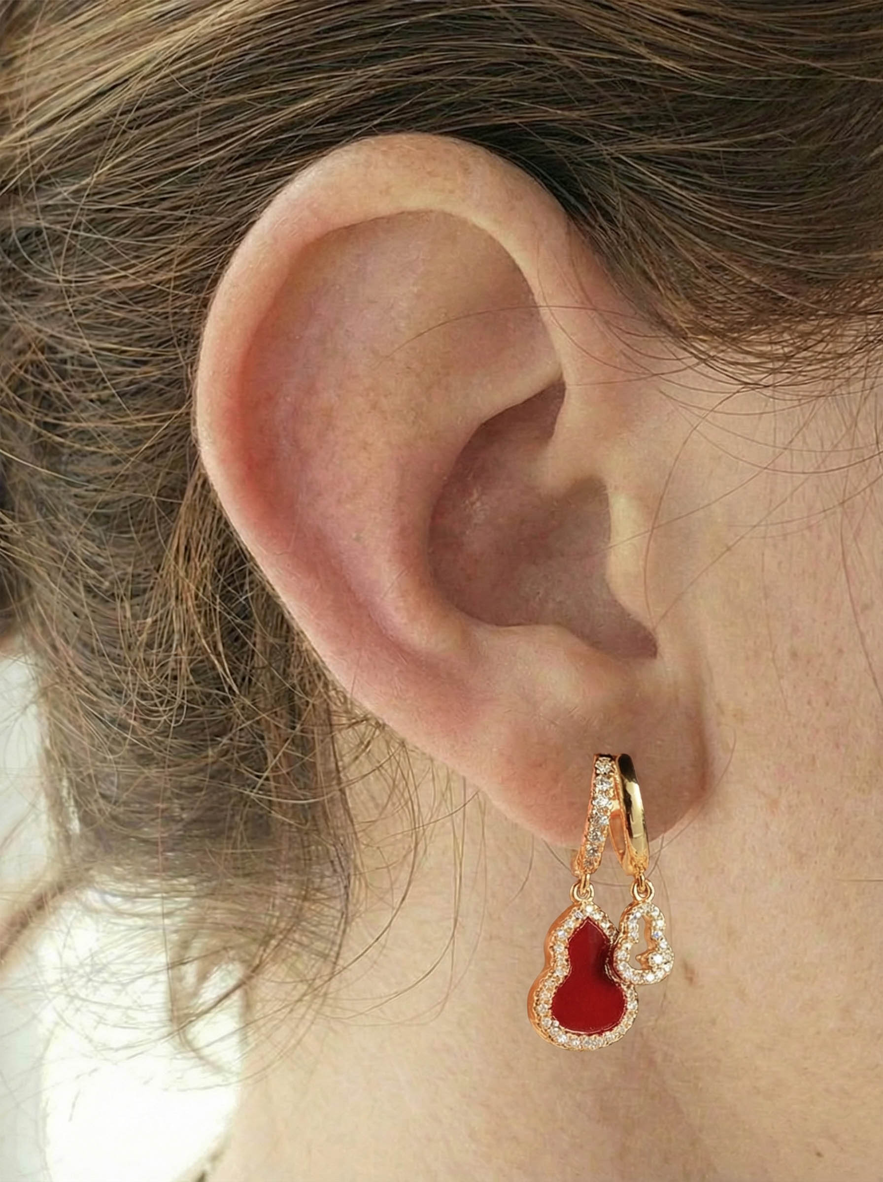 A pair of zirconia drop earrings featuring openwork ear hooks with real gold plating in an elegant, light-luxury Oriental style exquisite, versatile New Chinese-style earrings