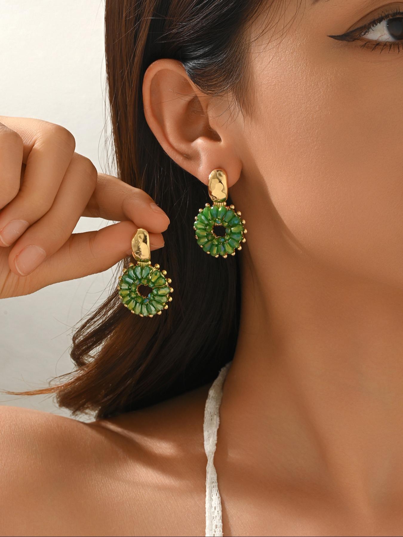 A pair of handcrafted, beaded dangle earrings featuring a chic Bohemian resort style. These round earrings exude an elegant, refined, and understated aesthetic with a premium feel, available in a variety of colors. for women to wear on any occasio