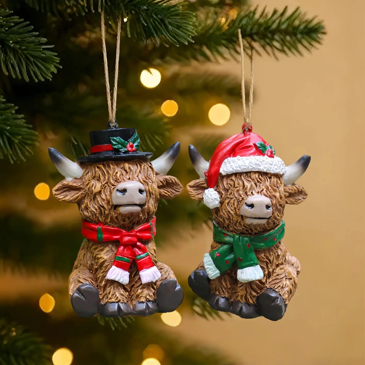 Set of 2 Highland Cow Christmas Ornaments – Featuring Santa hats and Scottish-style details; suitable for indoor/outdoor use, home party decor, and holiday gifting; a perfect Christmas gift choice; durable resin construction, no electricity required.