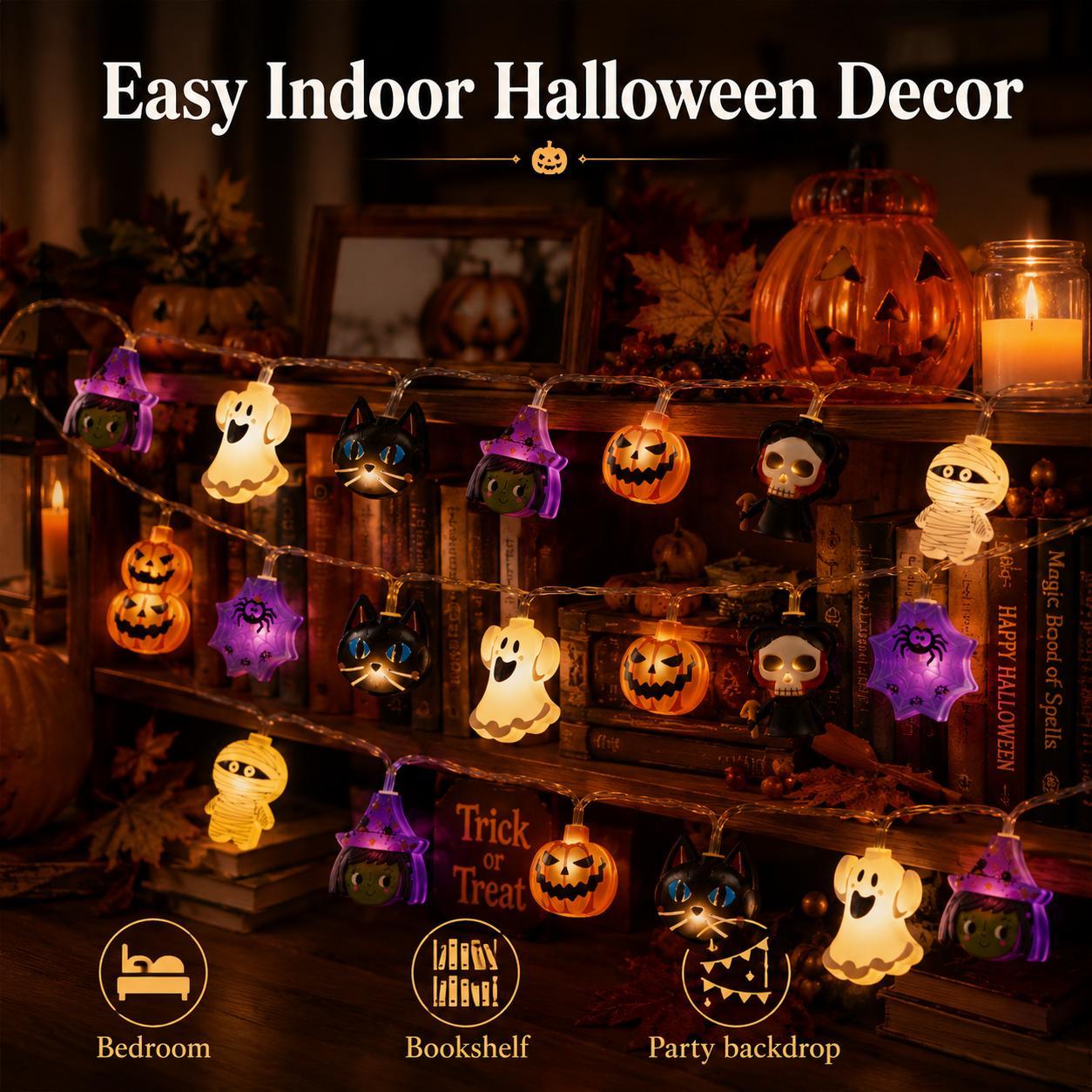 Halloween mixed character LED string lights glowing on a wooden display
