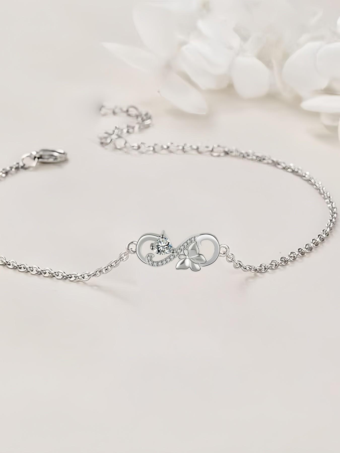 Butterfly Infinity · Diamond Glow Adjustable infinity symbol butterfly gem bracelet, delicate and sparkling.Paired with a surprise double-door preserved rose jewelry gift box.Ideal gift for birthdays, Mother’s Day and Valentine’s Day.