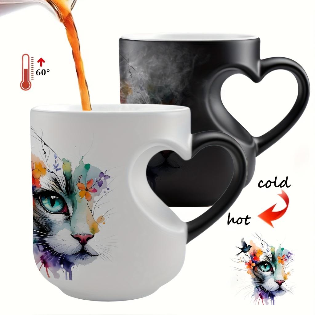 Playful Watercolor Cat Flower Decor: A vibrant artistic depiction set in a color-changing ceramic mug that changes color with temperature and features a heart-shaped handle. Perfect for coffee, this 11oz/330ml mug makes a wonderful Christmas gift
