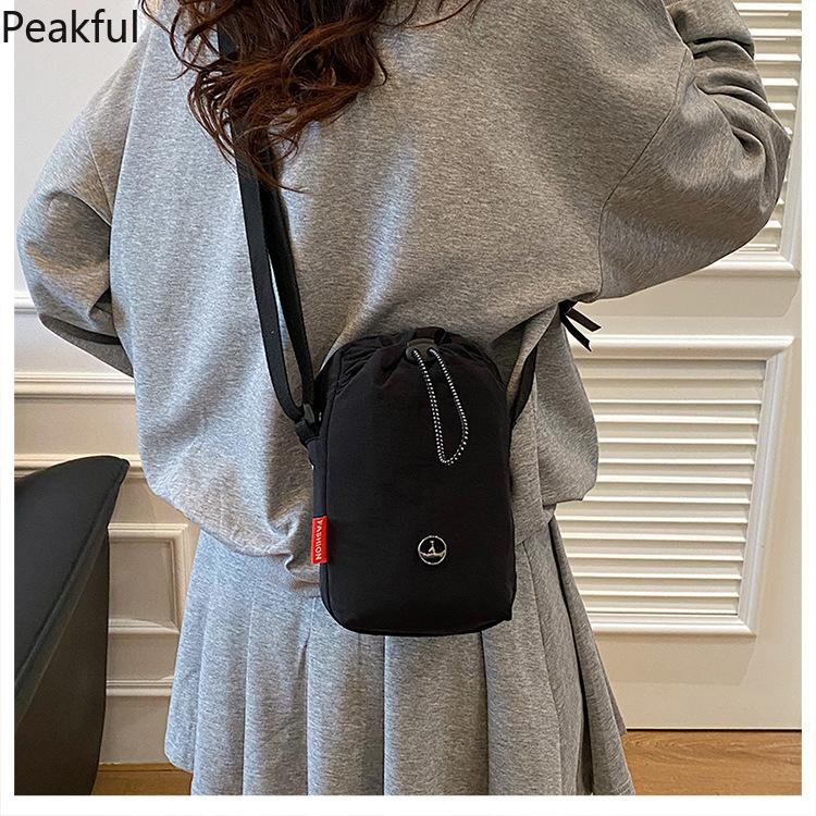 Viral Mini Drawstring Nylon Sling Bag, Fashion Casual Cinch Crossbody Purse, Lightweight Adjustable Strap Shoulder Bag, water-resistant fabric & multi-color options, ideal for travel, gym sessions and everyday hands-free use