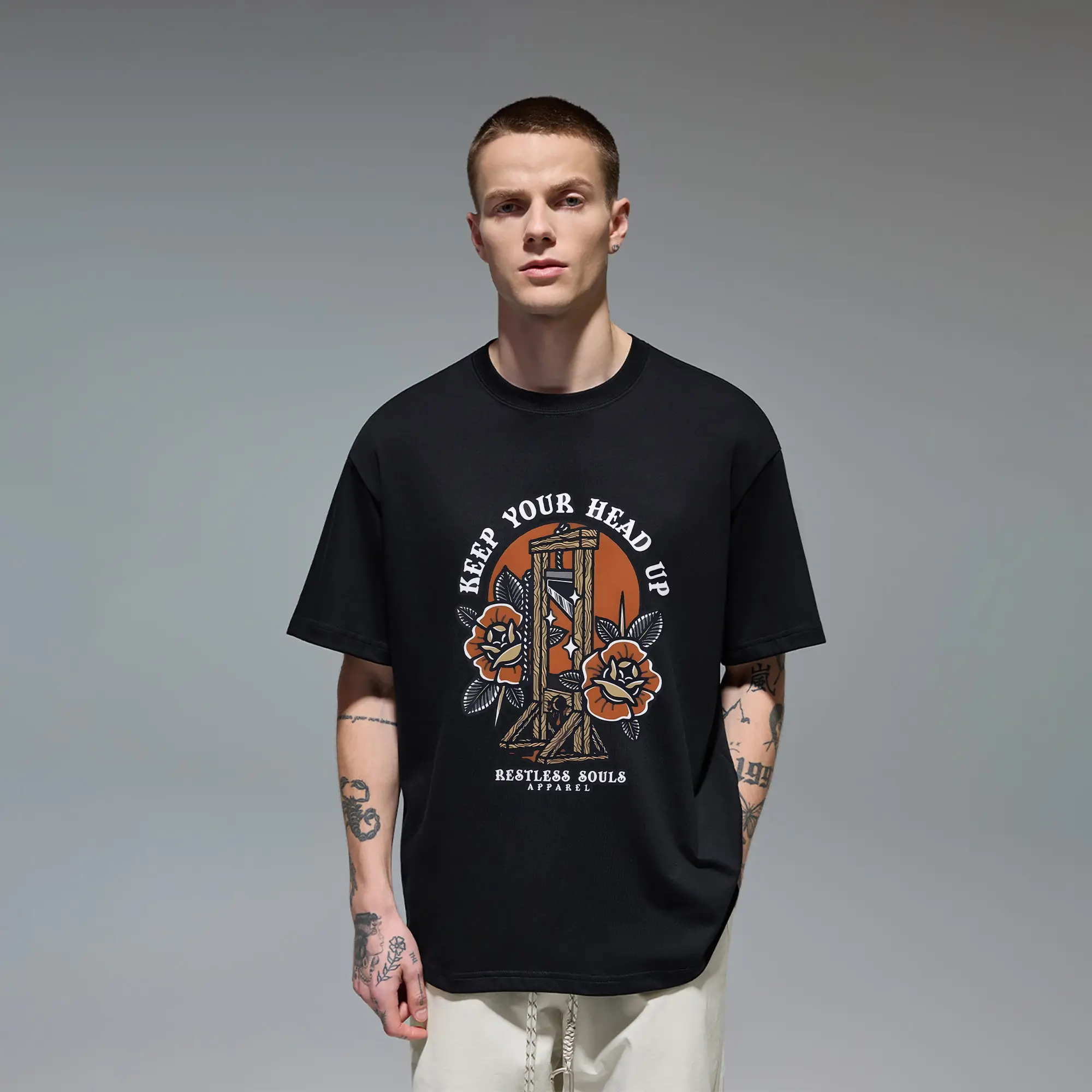 Retro tattoo‑art Men's T‑Shirt produced with Quality Cotton, shows vintage graphic with roses, sunset backdrop and "Keep Your Head Up" lettering. Soft lightweight crew‑neck tee, unique statement piece for alternative style lovers everyday casual outfits.