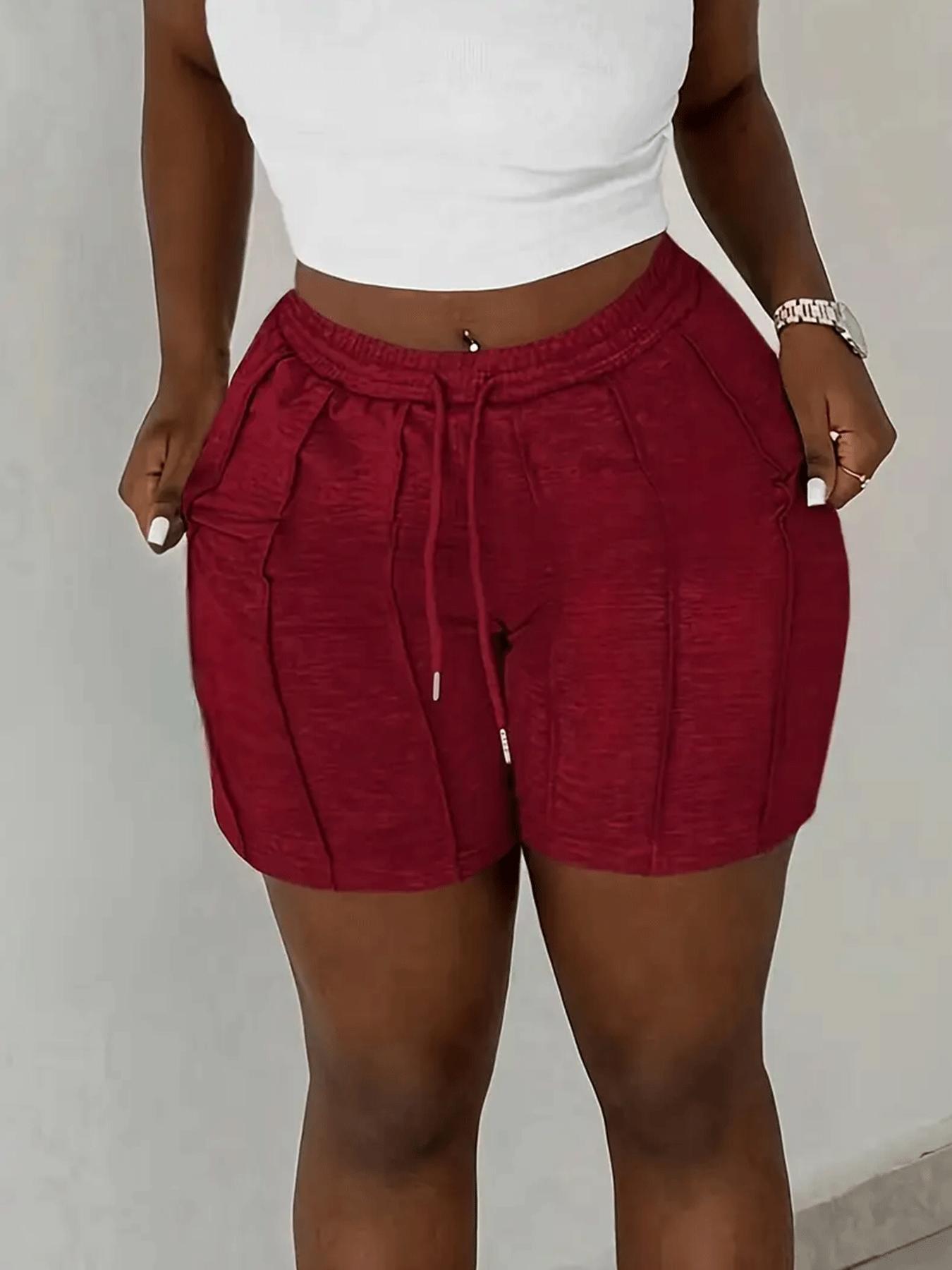 Pack of 2 solid-color drawstring athletic shorts with an elastic waistband and slanted pockets, casual style, suitable for spring, summer, and autumn.