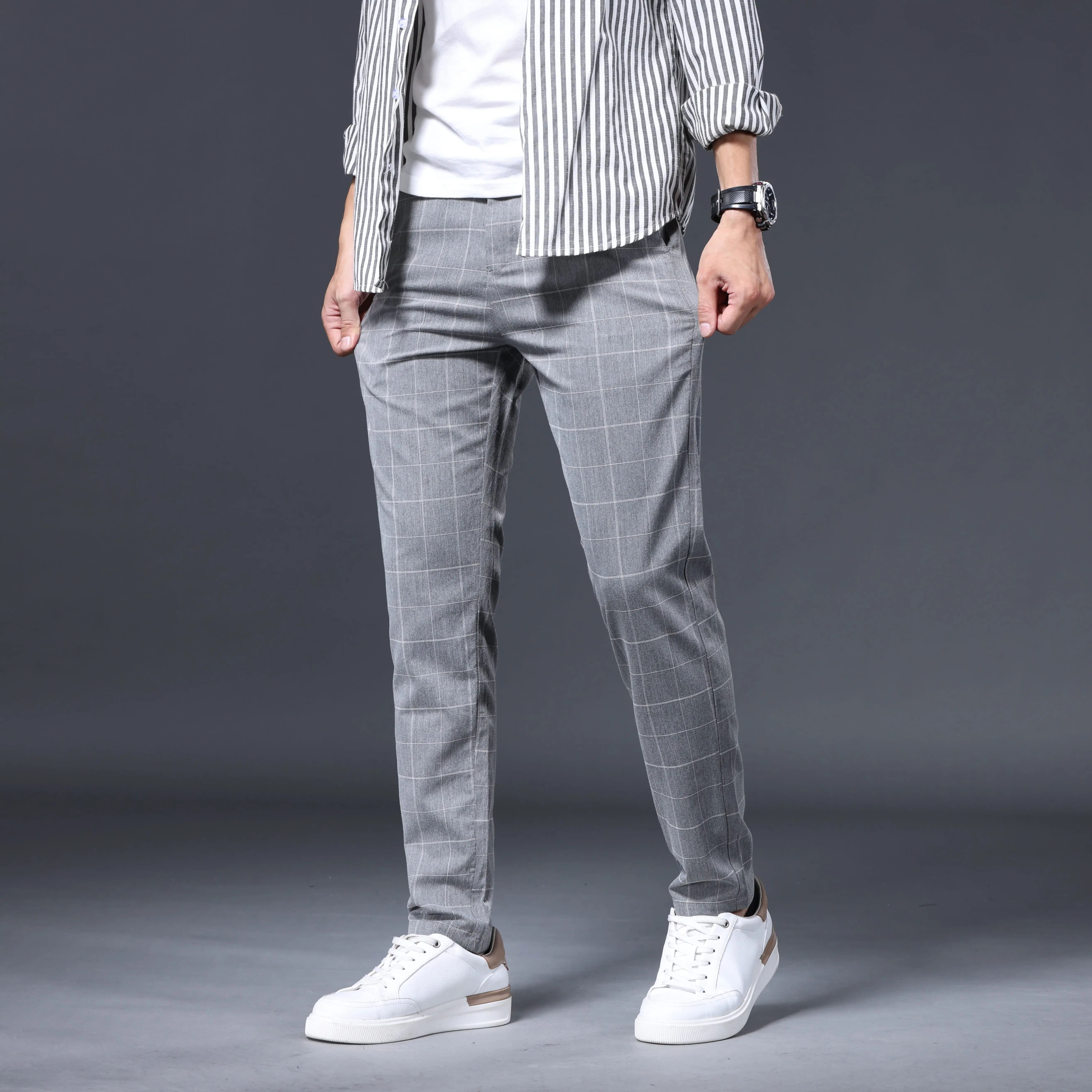 Men's slim-fit dress trousers made of polyester, spandex, and viscose fabric, available in multiple colors (sizes: 28-38).