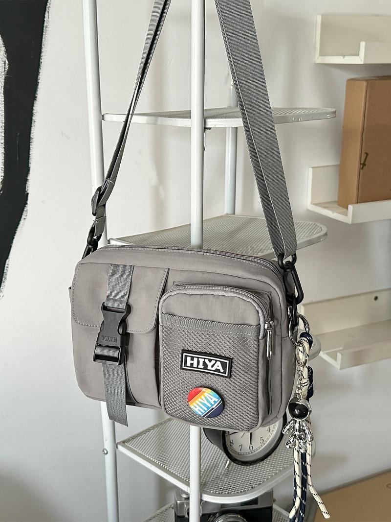 Unisex Casual Plain Color Release Buckle Crossbody Bag with Astronaut Charm, Fashionable Versatile Zipper Crossbody Bag with Random Color Badge, Trendy Shoulder Bag for Daily Use, Adjustable Crossbody Bag