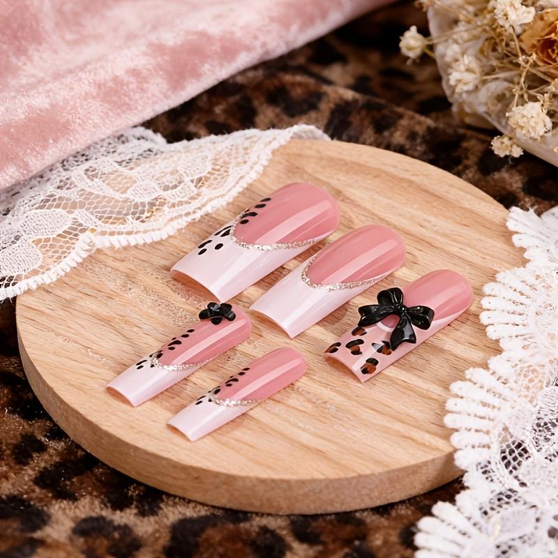 24 Pcs Long Coffin Pink 3D Water Ripple Drip Gel Wild Leopard Print French Press On Nails with Gold Beads, 3D Black Bow, Unique Gold Thin Lines & Sequin Design Removable False Nails with Jelly Glue and Nail File