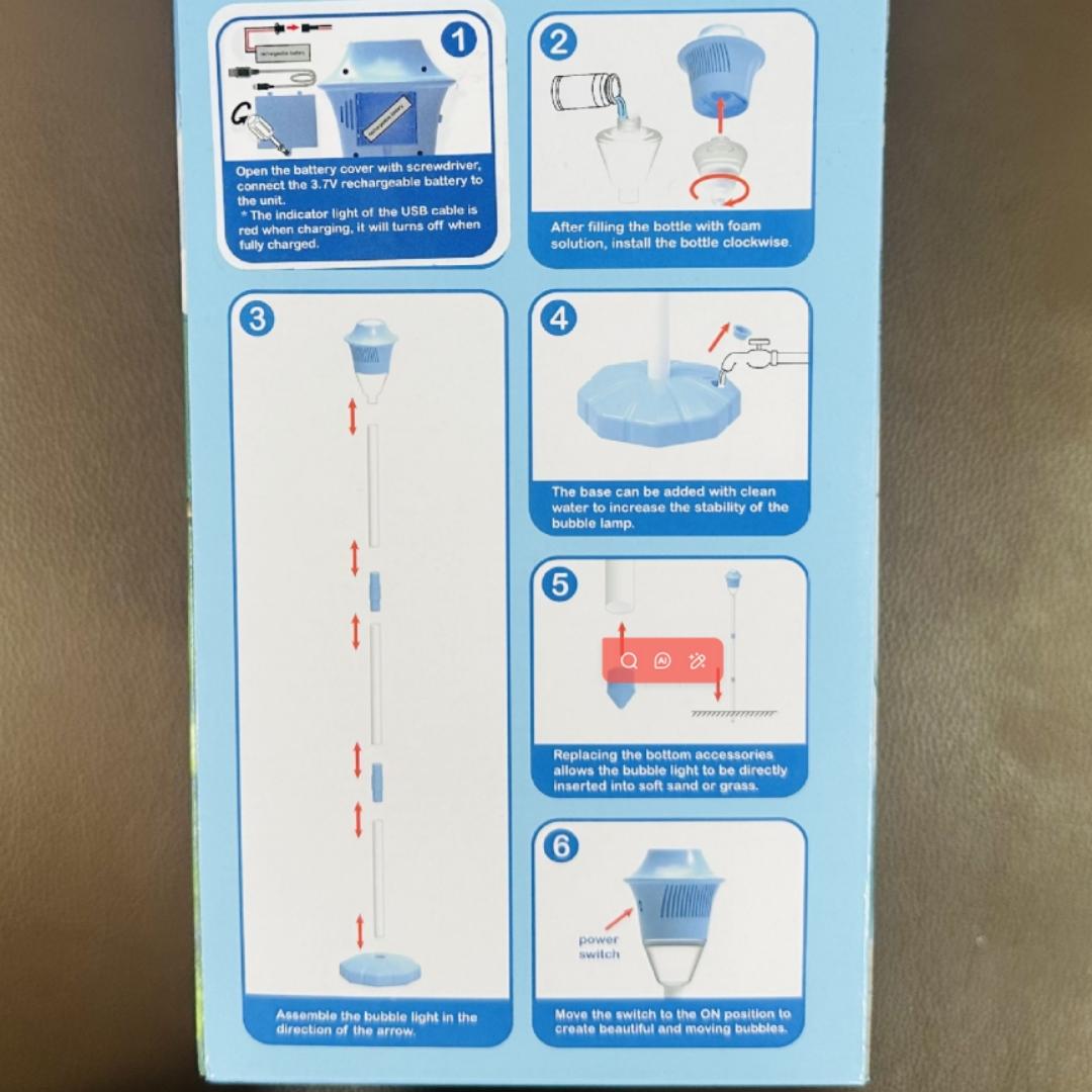 Streetlight Bubble Machine, “Torch” Bubble Machine with Music and Lights—an outdoor children's toy perfect for weddings and parties. Suitable for various occasions. Requires 3 AA batteries (not included). Recommended for ages 3 and up. Comes in a box.