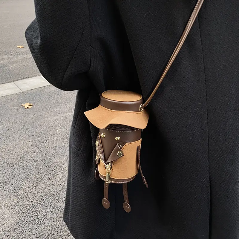 Playful Detective-Style Cylindrical Crossbody Bag – Cute cartoon character shoulder bag featuring a creative 3D figure design; perfect for women and girls for travel or street-style looks.