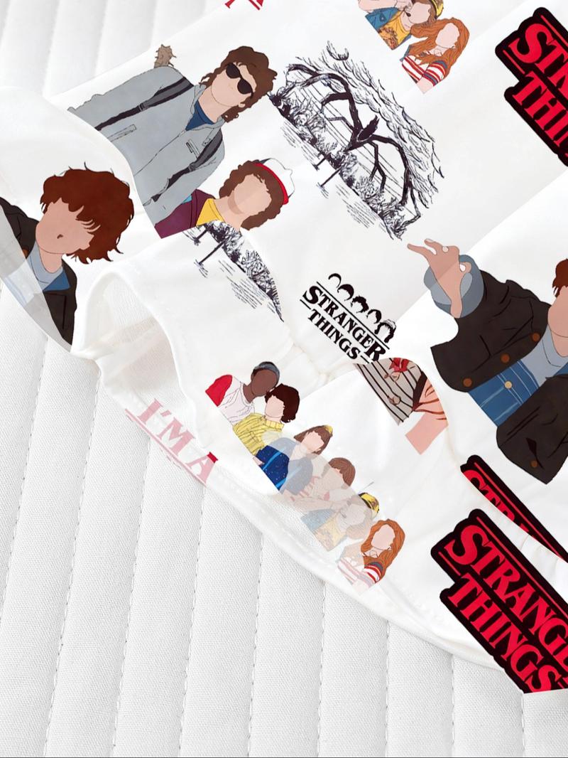 Stranger Things Cartoon Print Pajama Set for Kids - Summer Short Sleeve Cartoon Print Home Wear 2-Piece Set for Boys and Girls, New Flame-Retardant Turn-Down Collar Shirt and Loose Elastic Waist Ruffled Shorts Set. The pajamas feature iconic character pri