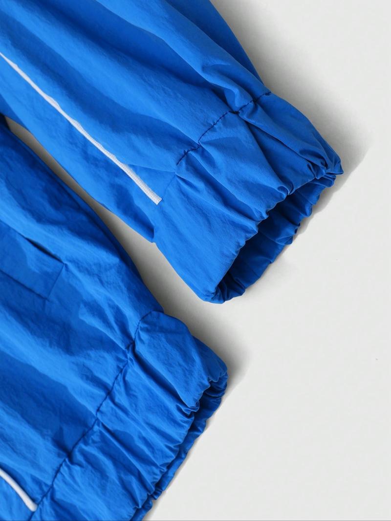 This men's two-piece Athletic Tracksuit Set includes a turtleneck jacket and sweatpants, featuring a striking blue and black color-block design with a unique sheen. Suitable for outdoor activities and casual wear, it also makes a great holiday gift.