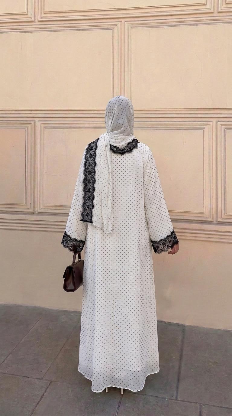 CL84 Elegant polka‑dot open abaya with matching hijab, delicate floral lace trim, soft premium‑quality fabric. White‑black and black‑white lace versions. Great for daily and formal occasions, ideal modest wear for hijabi women.