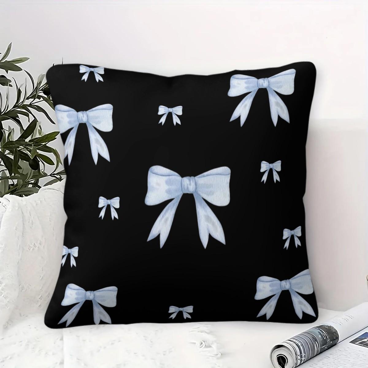Soft short plush throw pillow with black background and blue bowknot print pattern, featuring a variety of patterns, soft and skin-friendly, a comfortable good for home or travel, embodying a lazy home style