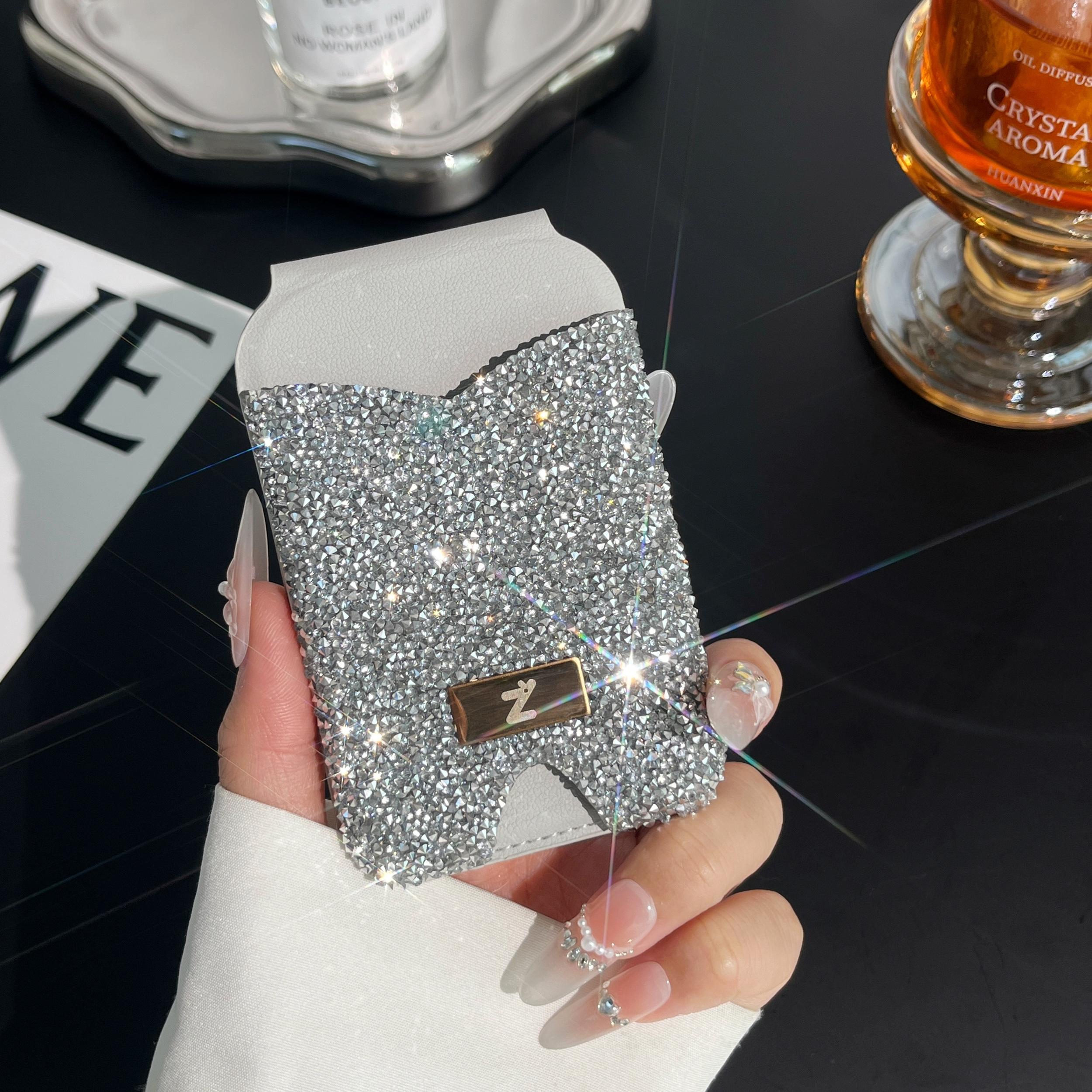 Strong magnetic anti-lost diamond phone holder with card holder and mirror. Lightweight and portable. Strong magnetic absorption of mobile phones. Can hold credit cards and ID cards. Suitable for magnetic mobile phones and magnetic mobile phone cases.