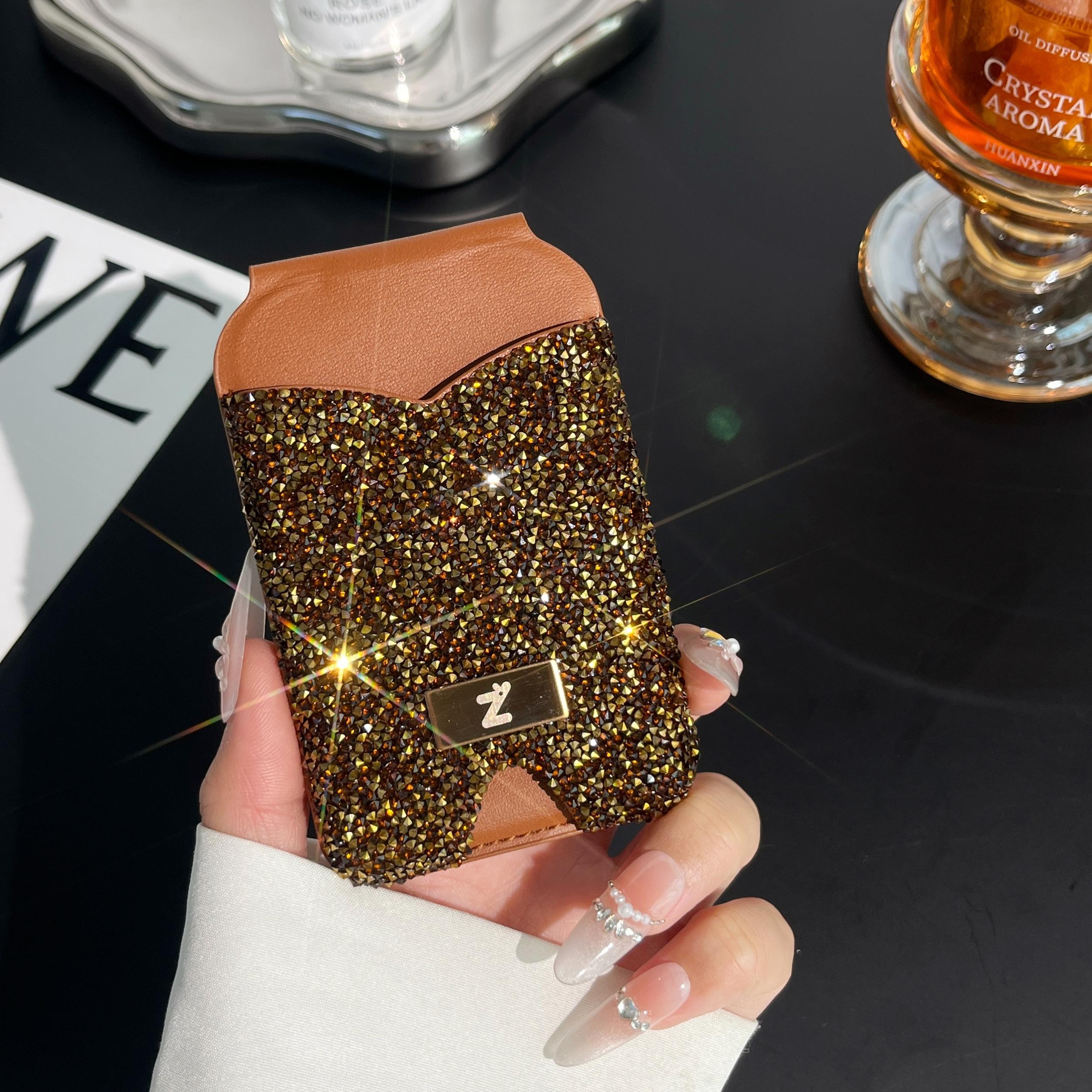 Strong magnetic anti-lost diamond phone holder with card holder and mirror. Lightweight and portable. Strong magnetic absorption of mobile phones. Can hold credit cards and ID cards. Suitable for magnetic mobile phones and magnetic mobile phone cases.