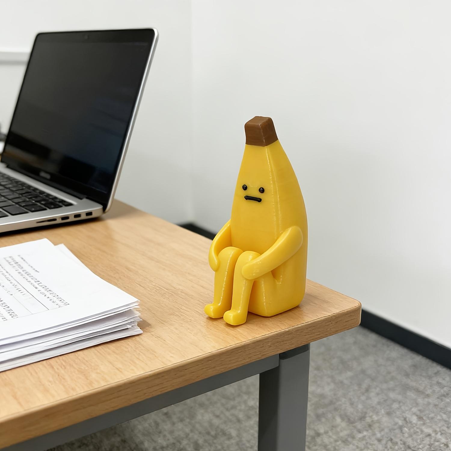 A 3D-printed "Anxious Banana" ornament, crafted from durable plastic—perfect for use as a home tabletop display, office decor, or a unique decorative accent.