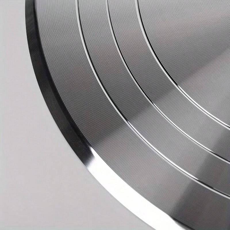 This aluminum cake turntable features 360-degree rotation, a non-slip base, and a heavy-duty smooth rotating stand. Suitable for 4-8 inch cakes, it's ideal for cake decorating, baking, and frosting preparation.
