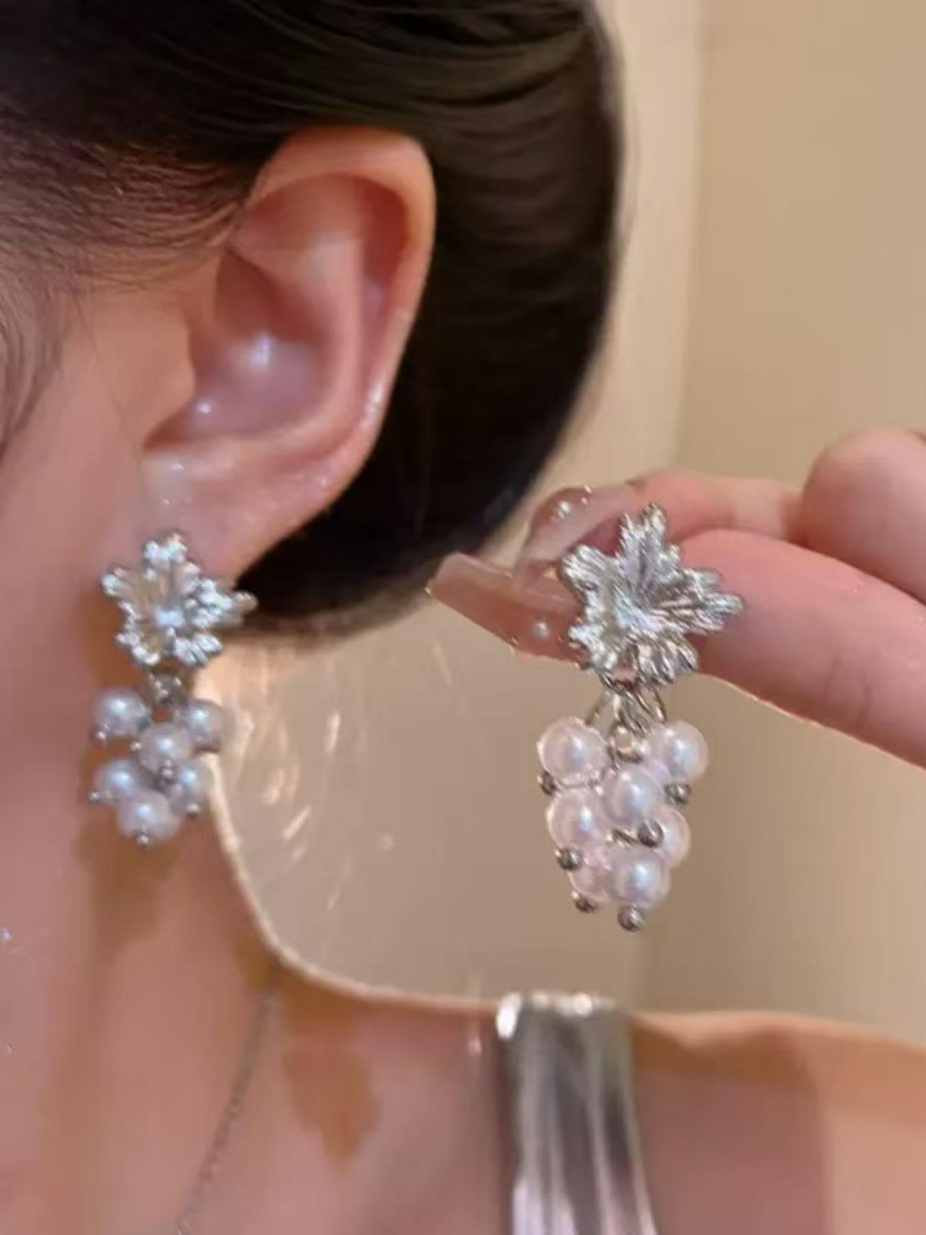 Exquisite metallic maple leaf shape with layered pearl tassels, creating a gentle and romantic vibe. The dangle design sways elegantly, adding a touch of sophistication to your daily look.