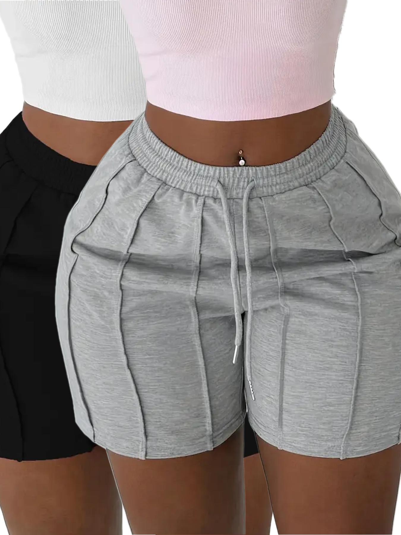 Pack of 2 solid-color drawstring athletic shorts with an elastic waistband and slanted pockets, casual style, suitable for spring, summer, and autumn.