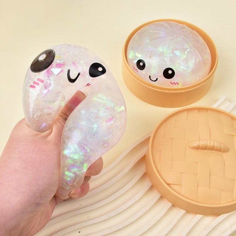 Cute Glitter Dumpling Stress Toy — a smiley-face squeezable sensory toy that’s fun for both kids and adults. Perfect for relaxation and desktop play, it also makes a great gift and a fun icebreaker for socializing and gatherings.