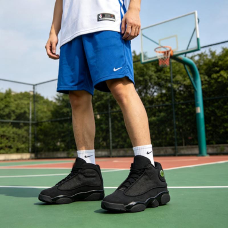Classic Black High-Top Basketball Sneakers with Iconic Side Eye Detail & Cushioned Midsole for Streetwear