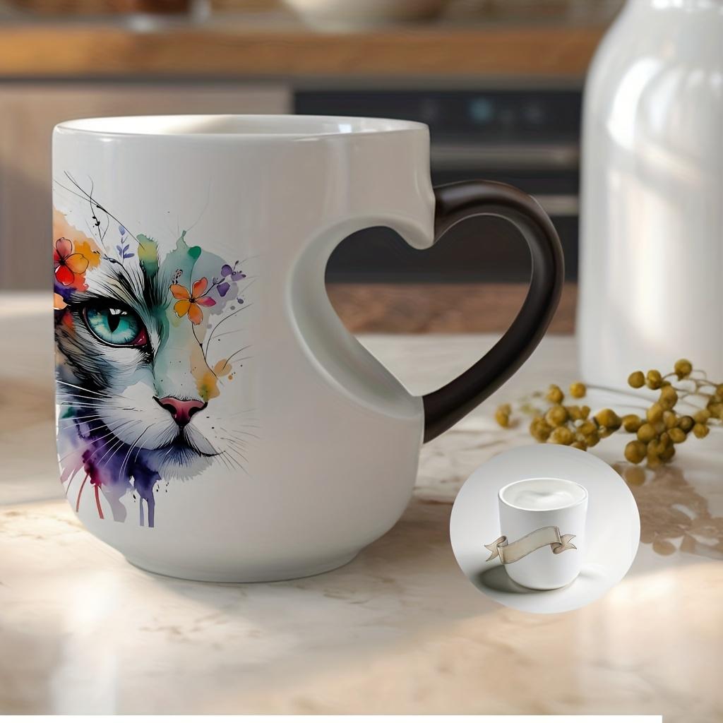 Playful Watercolor Cat Flower Decor: A vibrant artistic depiction set in a color-changing ceramic mug that changes color with temperature and features a heart-shaped handle. Perfect for coffee, this 11oz/330ml mug makes a wonderful Christmas gift