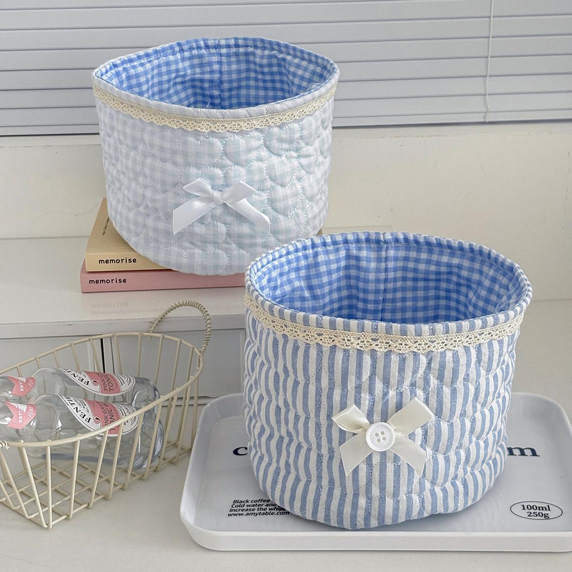 Cute lace bow patchwork storage basket, round fabric desktop organizer box, Instagram-style plaid print storage bin, soft padded makeup storage box, attractive pink bow storage bucket, foldable desktop storage basket