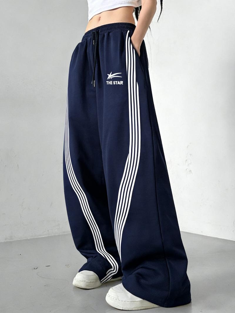Women's Wide-Leg Track Pants, elastic drawstring waist with contrast side stripes and "THE STAR" logo print, relaxed fit for streetwear, dance and casual daily wear, available in multiple colors
