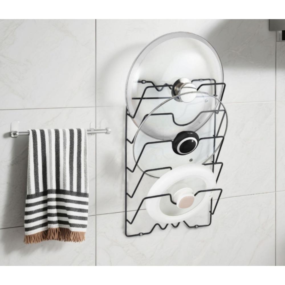 Sturdy hooks for hanging pot lids: a multi-layer wall-mounted storage solution suitable for pots and lids, a space-saving kitchen accessory, ideal for homes and restaurants.
