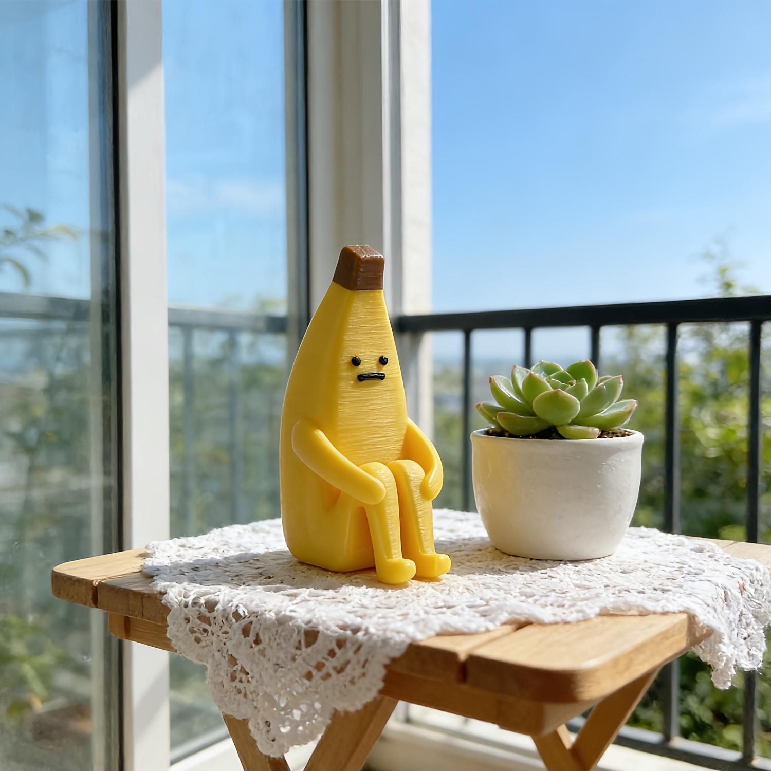 A 3D-printed "Anxious Banana" ornament, crafted from durable plastic—perfect for use as a home tabletop display, office decor, or a unique decorative accent.