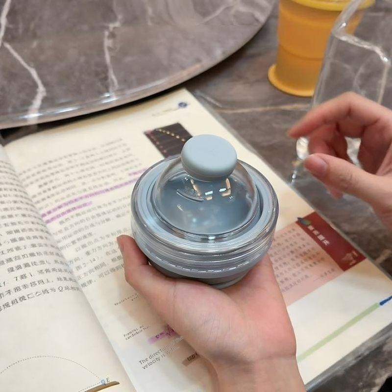 Food-grade silicone folding ice ball cup - dual-purpose ice water drinking cup. Two-in-one functional summer portable water cup with a straw.