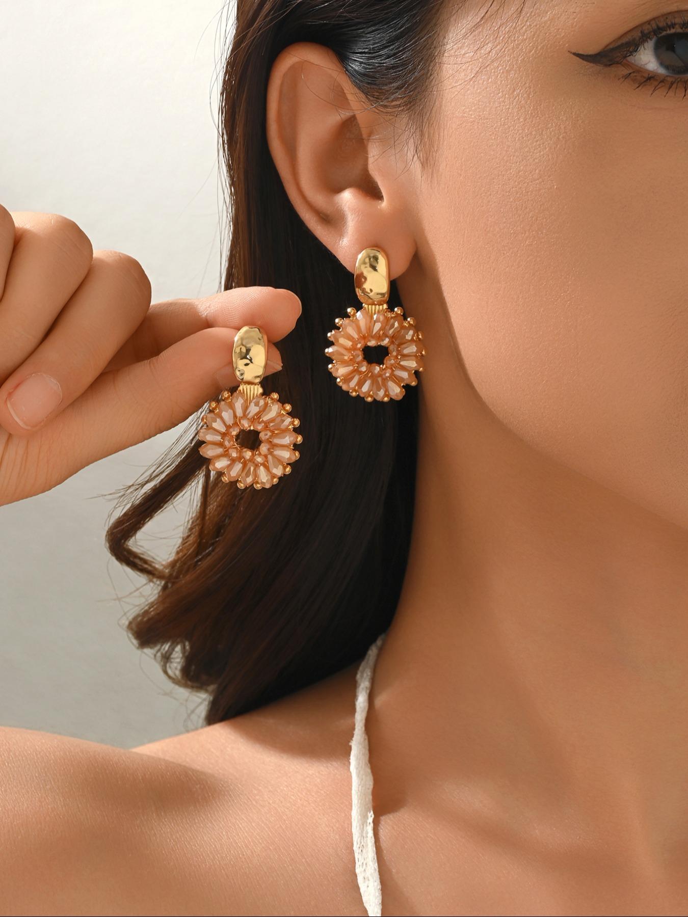 A pair of handcrafted, beaded dangle earrings featuring a chic Bohemian resort style. These round earrings exude an elegant, refined, and understated aesthetic with a premium feel, available in a variety of colors. for women to wear on any occasio