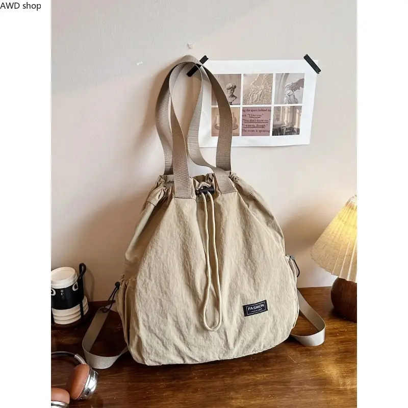 1pc Ladies' Drawstring Nylon Backpack With Rope and Cloth Tag Decoration, Large Capacity Lightweight Daily Backpack For Campus, Commuting and Short Distance Travel, Simple Casual Backpack