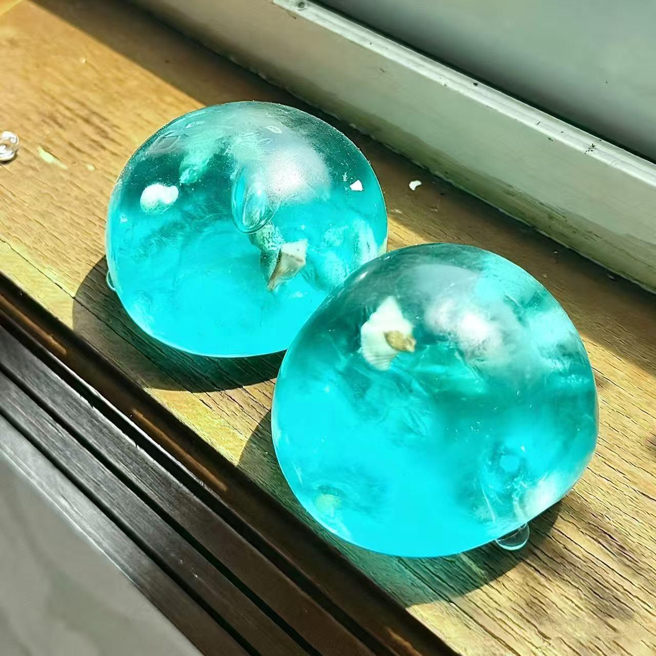 1pc Jell-O Ocean Ball Squeeze Toy, a soft, slow-rebound sensory toy. A breathable, relaxing, soft, and slow-bouncing stress-relief desk gadget with a durable, unique design. An essential relaxation tool for adults, perfect for desks, study tables, Easter