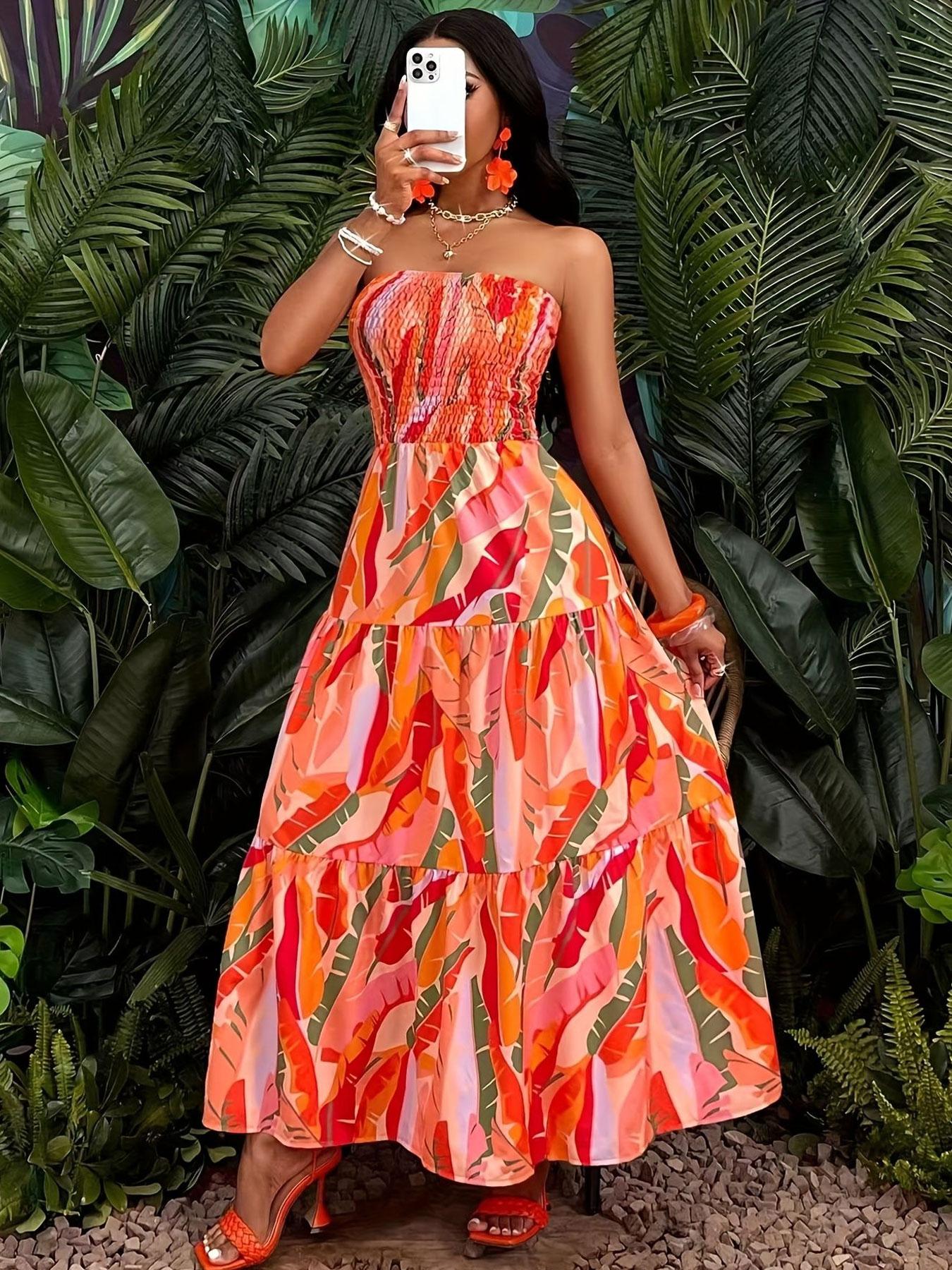 A women's orange-red color-block tropical floral print strapless tube long fashionable dress, suitable for summer, island vacations, tropical trips, and summer parties.