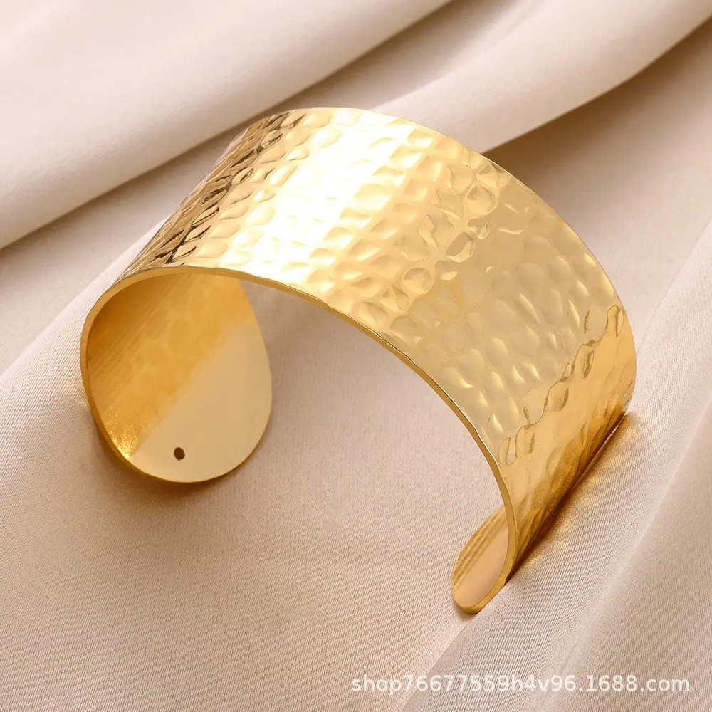 Golden geometric embossed wide open bracelet