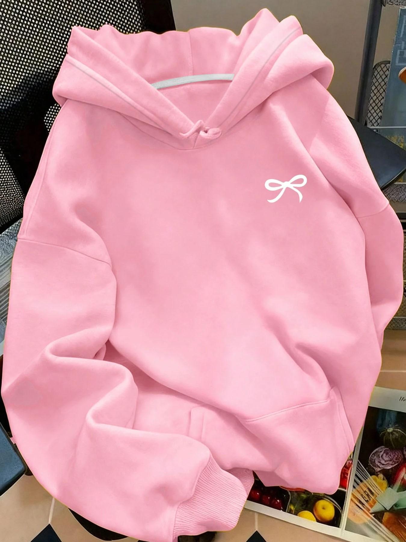 Soft fleece-lined, relaxed-fit graphic style with a bowknot, kangaroo pocket and adjustable drawstring hood. This on-trend hoodie sweatshirt pullover is perfect for versatile daily casual wear in fall and winter.