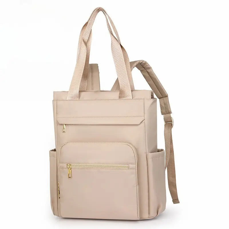 Women’s nylon tote backpack with multiple pockets, featuring a top handle and adjustable shoulder straps; a lightweight, casual daypack perfect for daily commuting, work, travel, and shopping—includes side pockets